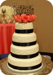 Wedding Cake with Scroll work and Fresh Flowers